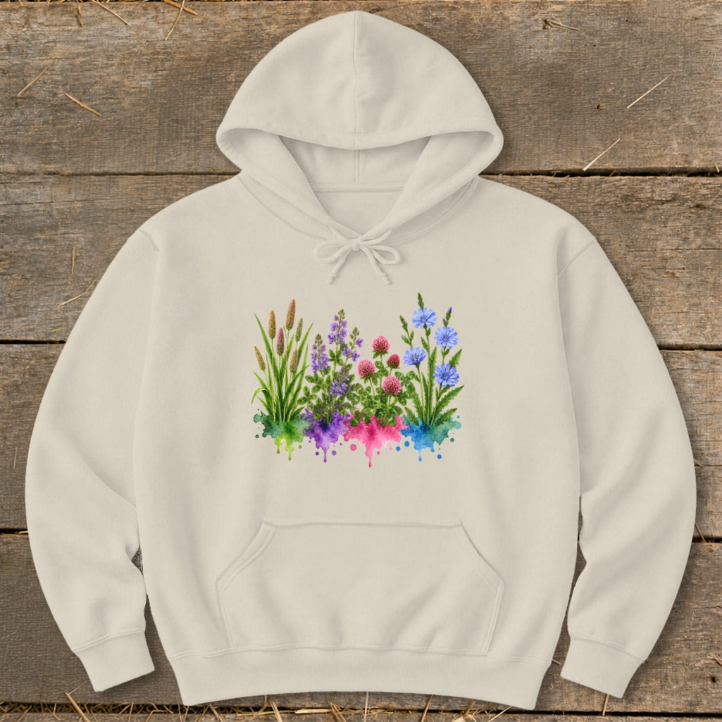 A cream-colored hoodie featuring a watercolor graphic of wildflowers and grasses across the chest.
