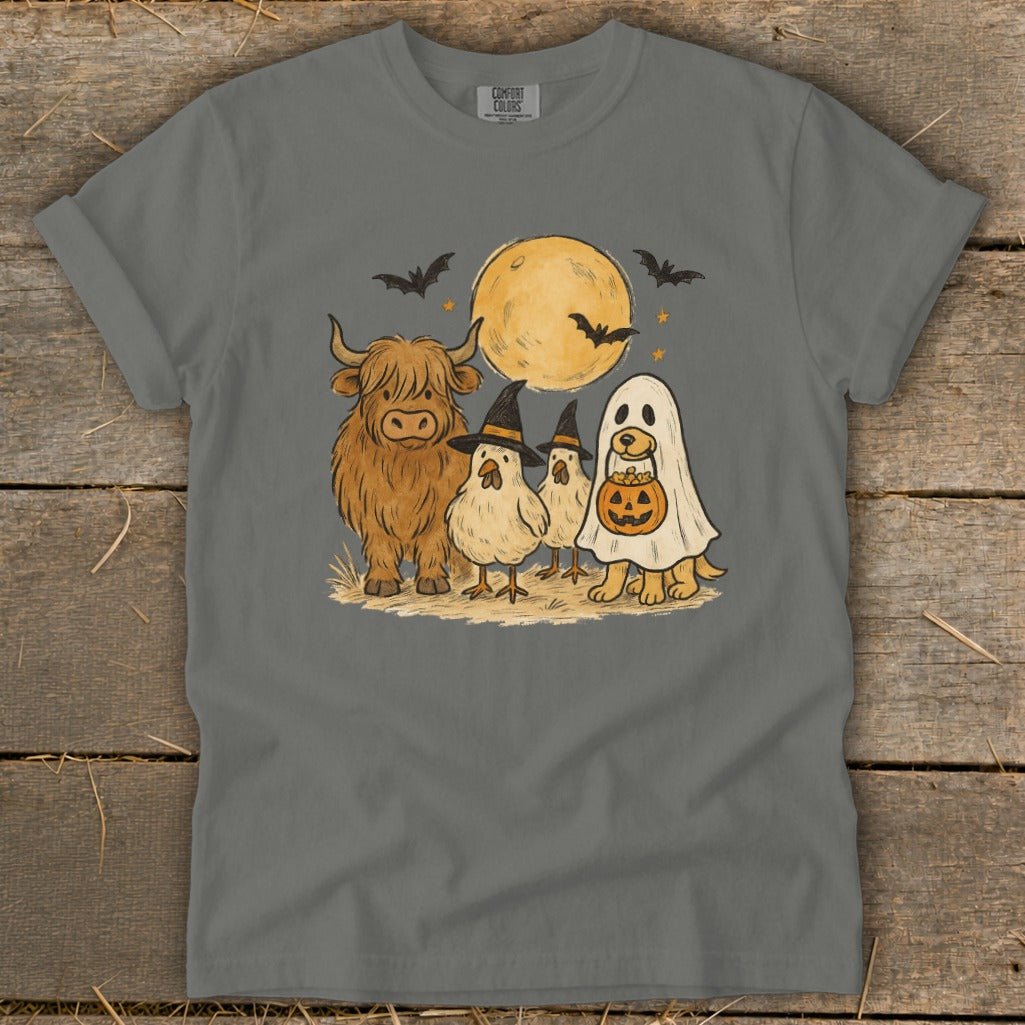 Highland cow, chicks in witch hats, and dog in ghost costume with pumpkin bucket.