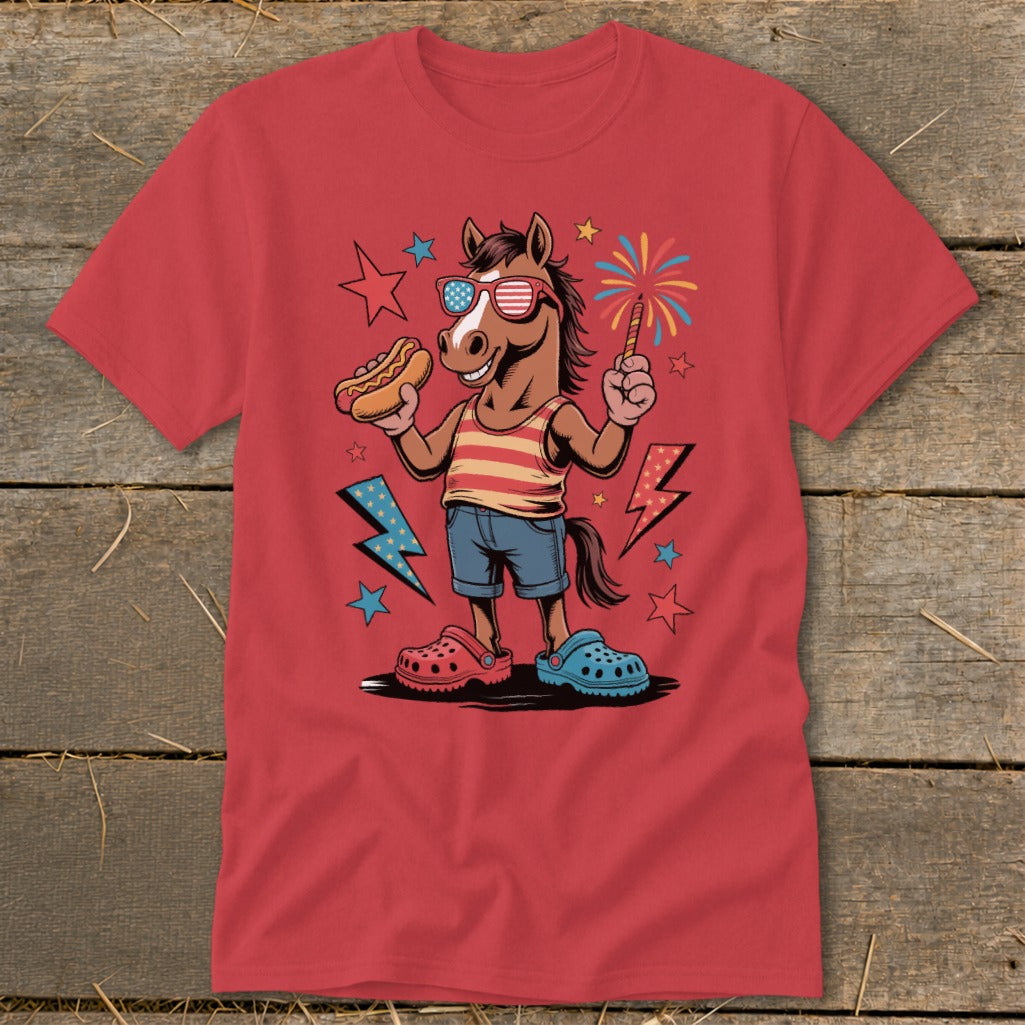 Horse in patriotic sunglasses holds hot dog and sparkler, wearing shorts and clogs.