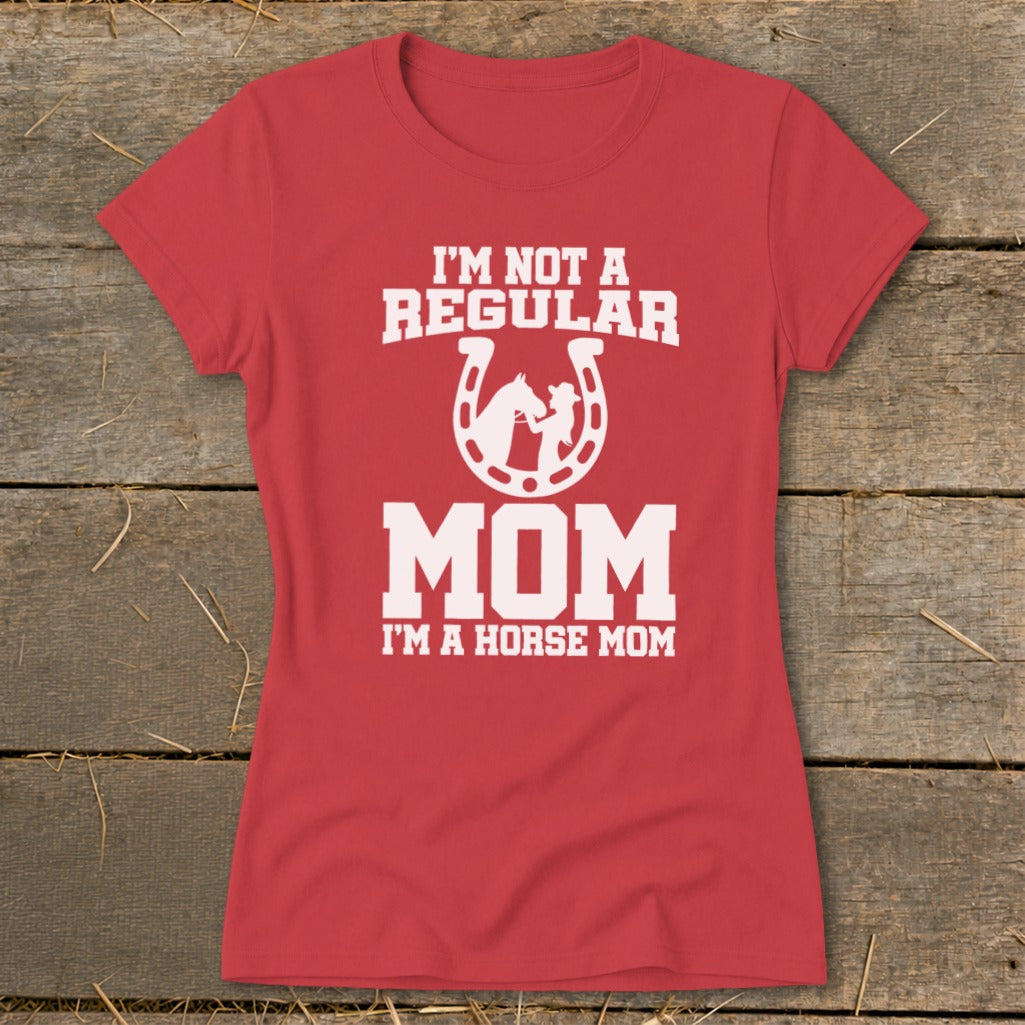 Red t-shirt with white text: "I'm Not A Regular Mom I'm A Horse Mom" and horseshoe graphic.