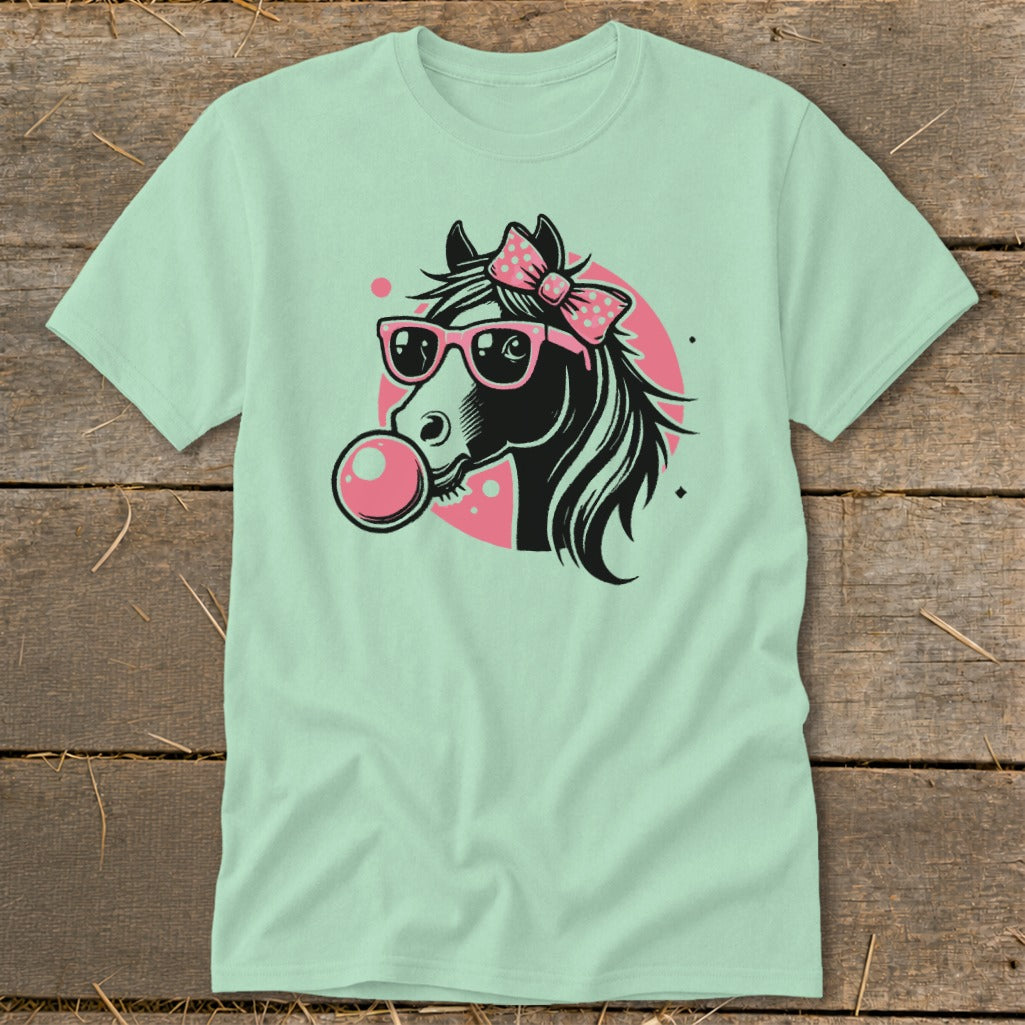 Black horse with pink bow and sunglasses blows bubble gum on mint t-shirt.