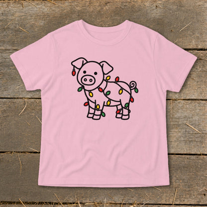 Light pink t-shirt featuring a line drawing of a pig wrapped in colorful Christmas lights.