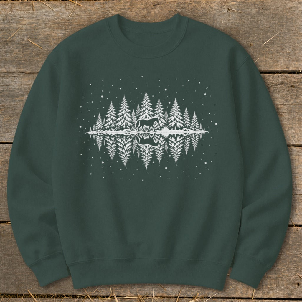 Dark green sweatshirt with white silhouette of horse and pine trees reflected in water.