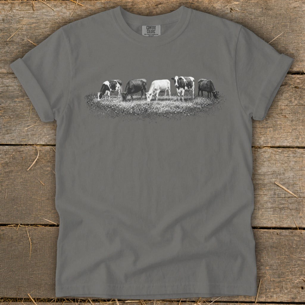 Gray t-shirt with a graphic of five cows grazing in a field.