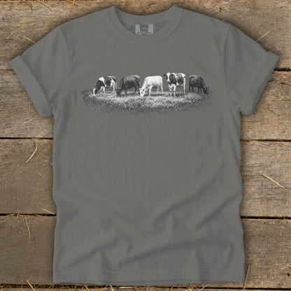 Gray t-shirt with a graphic of five cows grazing in a field.