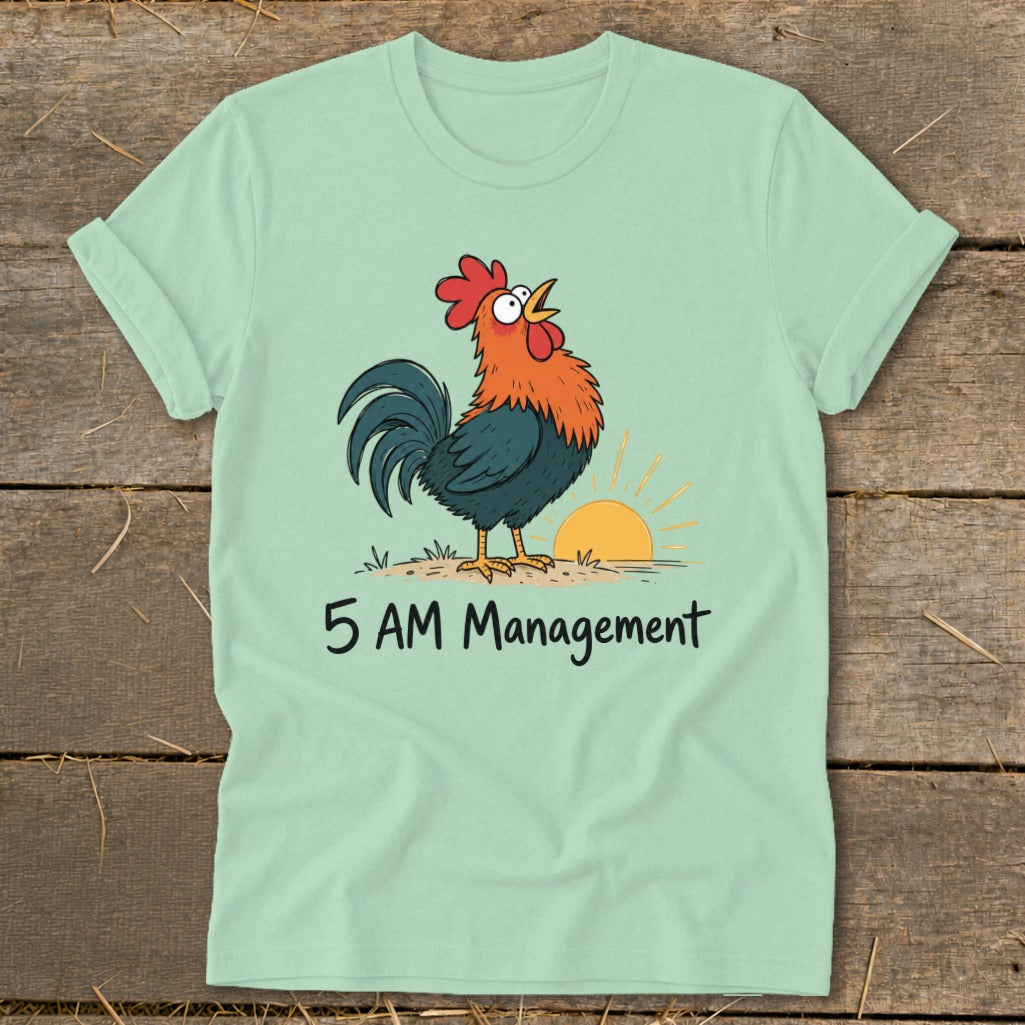 Light green t-shirt with a cartoon rooster crowing at sunrise, text "5 AM Management".