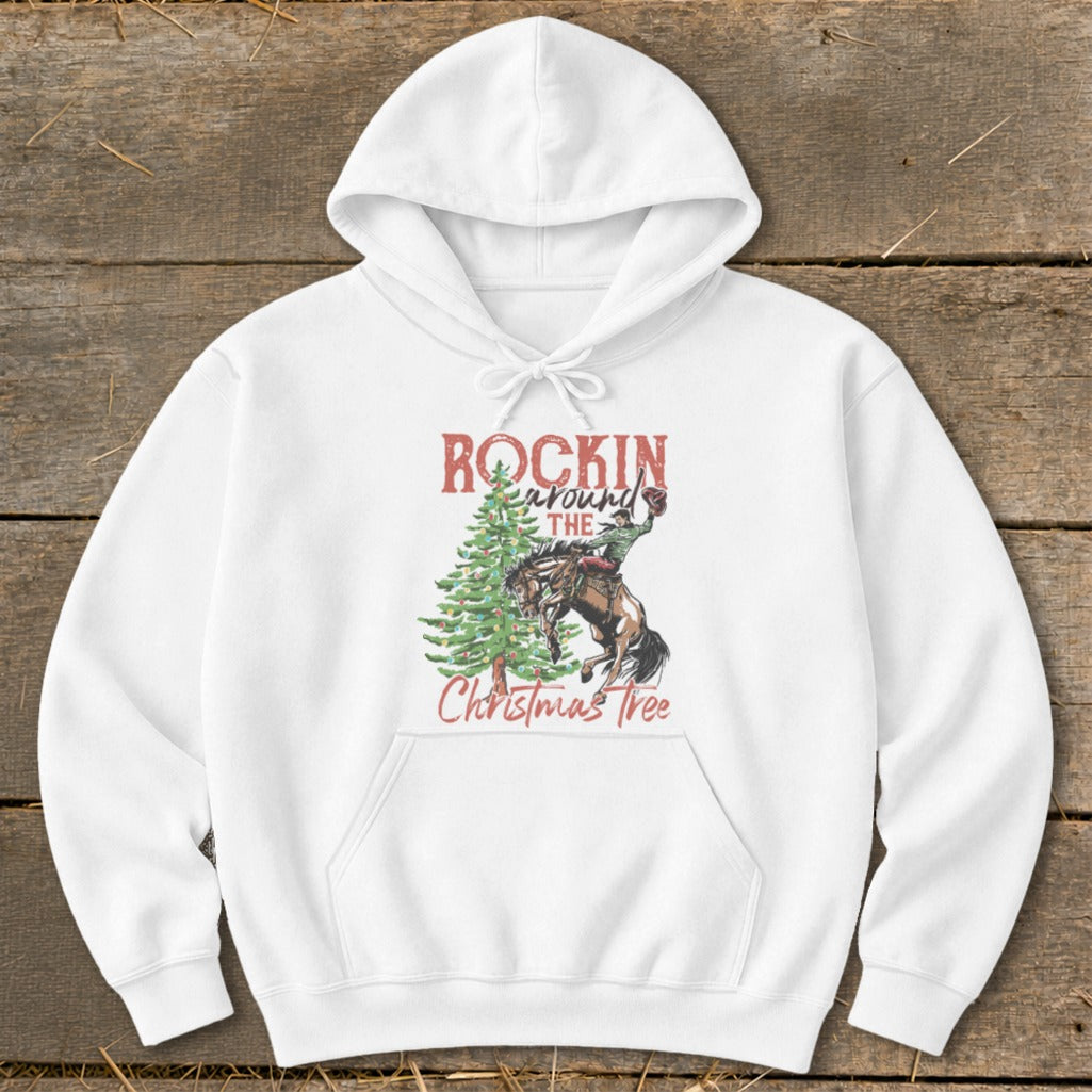 White hoodie with "Rockin' Around The Christmas Tree" text and rodeo cowboy on horse.