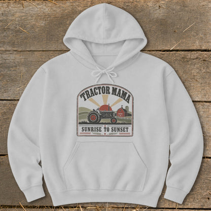 White hoodie with "Tractor Mama Sunrise to Sunset" graphic featuring a tractor and barn.