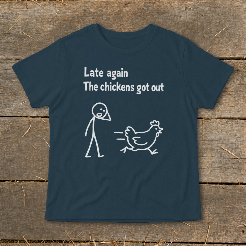 Dark blue t-shirt with white text and stick figure: "Late again The chickens got out"