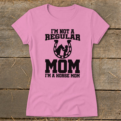 Pink t-shirt with "I'm Not a Regular Mom I'm a Horse Mom" text and horseshoe graphic.
