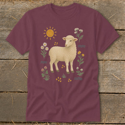 Maroon t-shirt with a fluffy sheep surrounded by sun, flowers, and wavy lines.