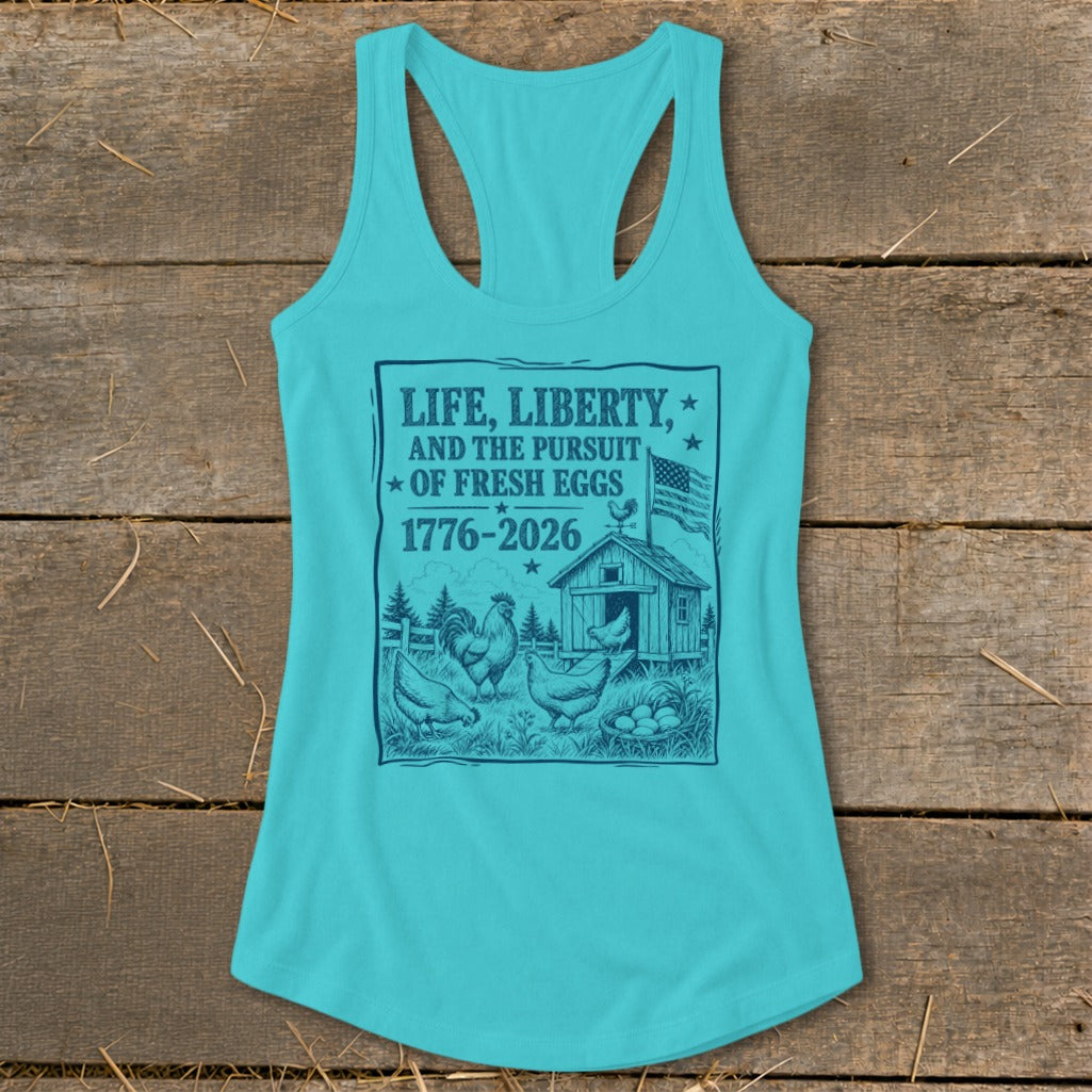 Turquoise tank top with "Life, Liberty, and the Pursuit of Fresh Eggs" text and farm scene.