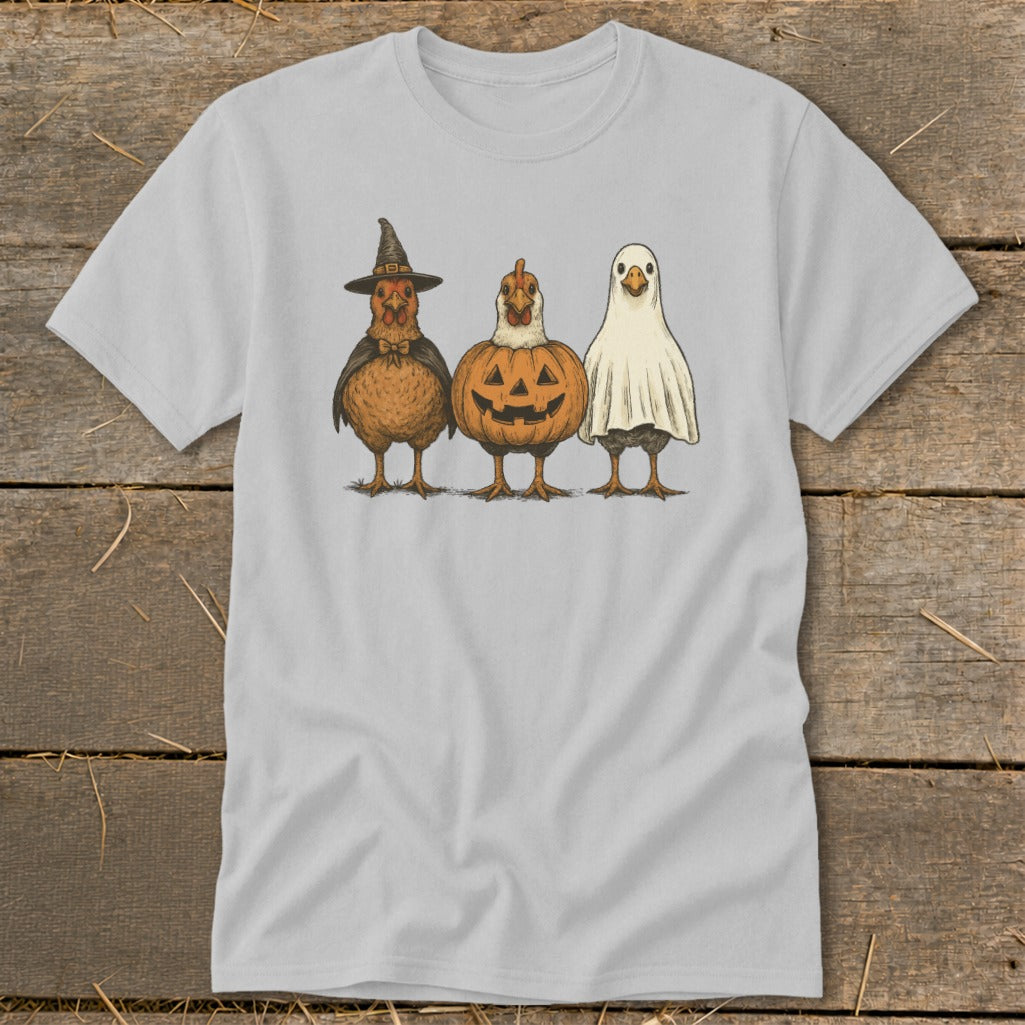 Three cartoon chickens dressed for Halloween: witch, pumpkin, and ghost.