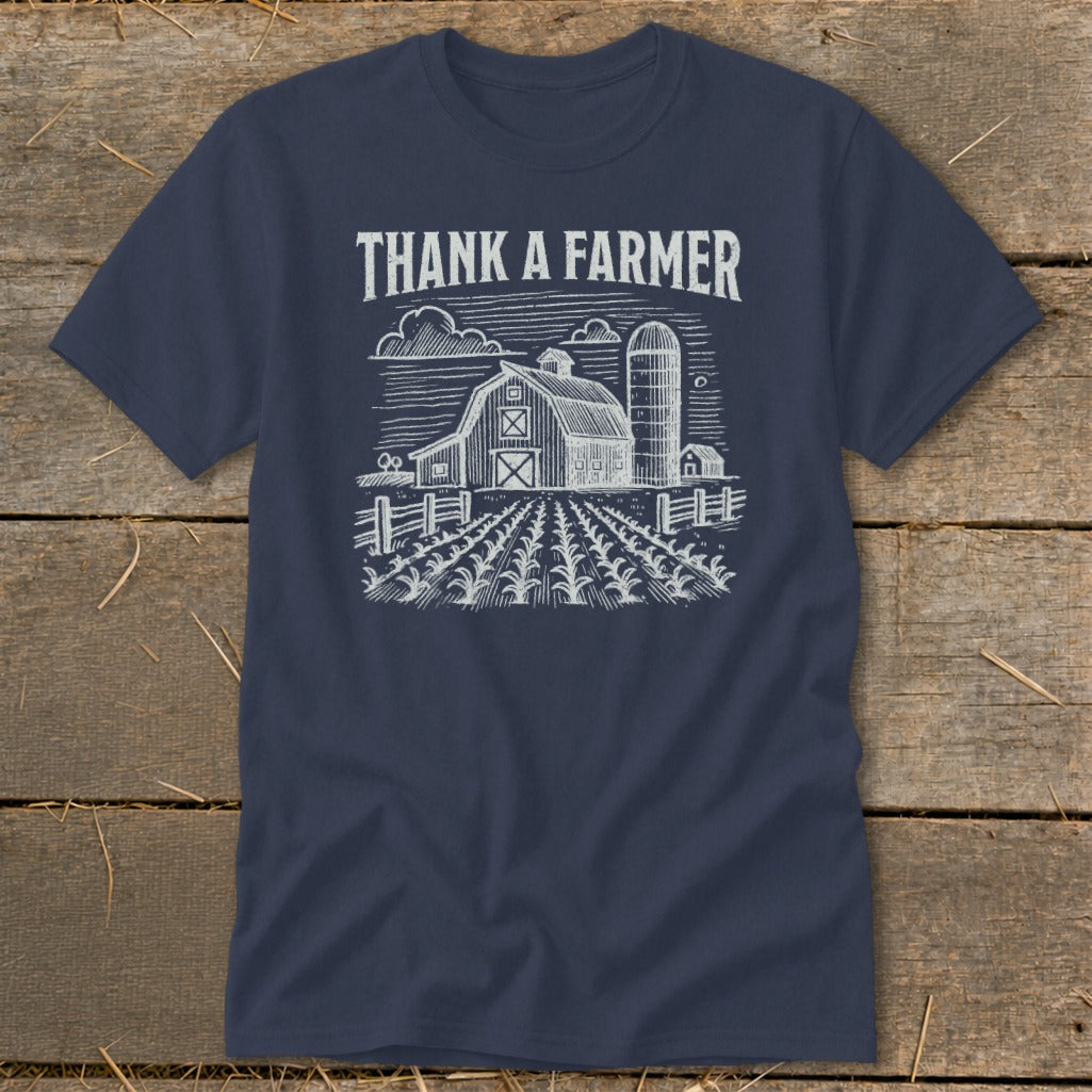 Navy t-shirt with white "THANK A FARMER" text and barn sketch.