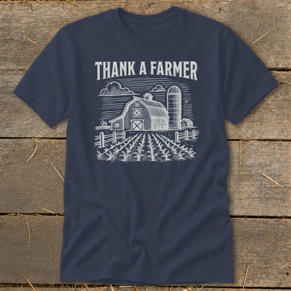 Navy t-shirt with white "THANK A FARMER" text and barn sketch.