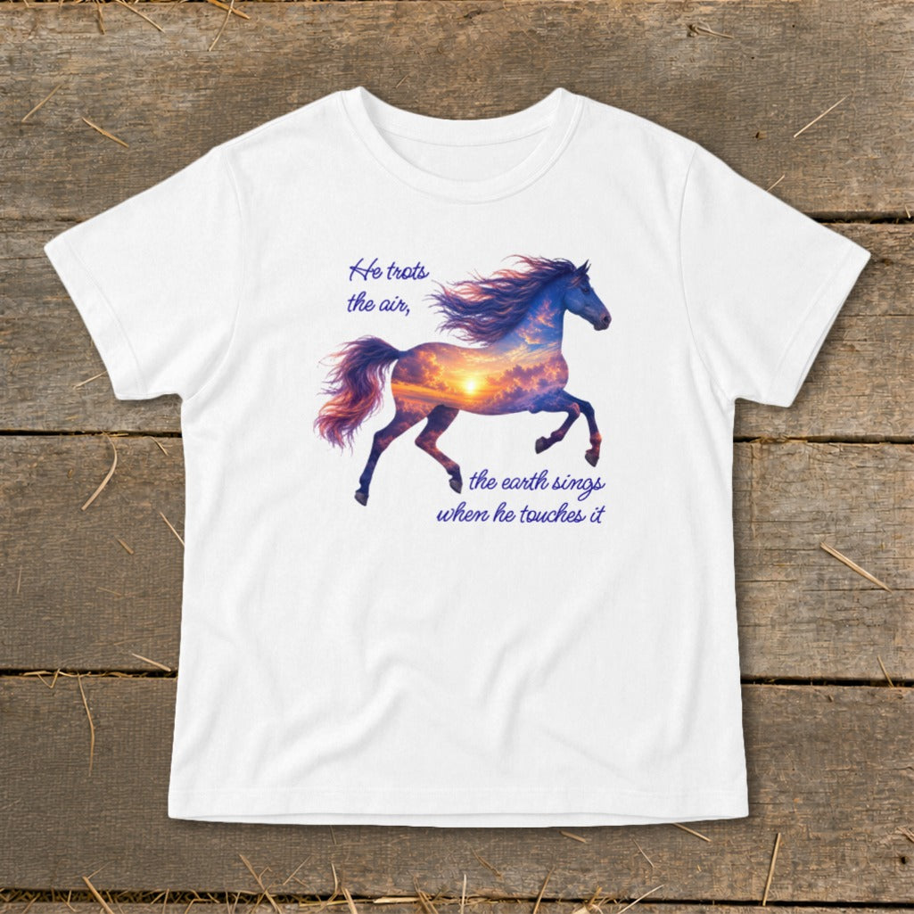 A white t-shirt featuring a galloping horse graphic filled with a sunset sky and quote text.