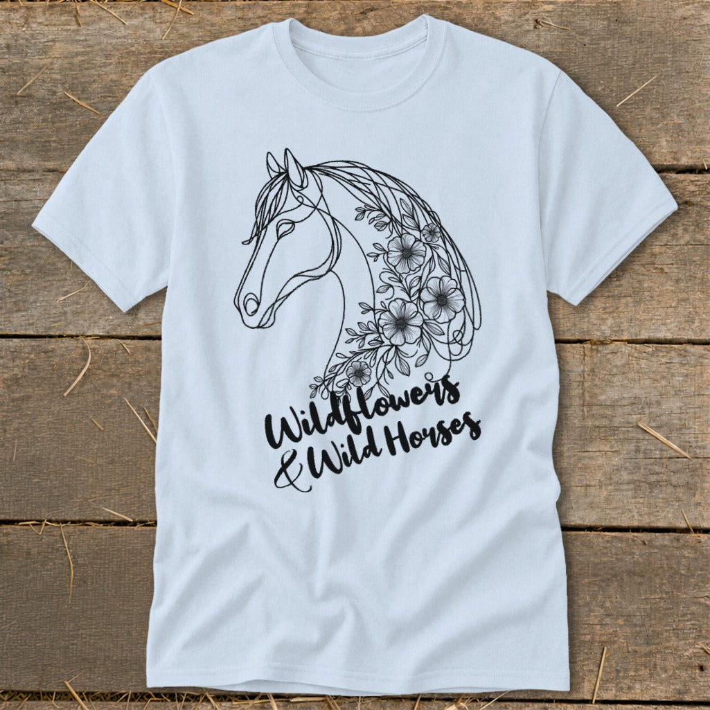 White t-shirt with a black line drawing of a horse's head decorated with flowers.