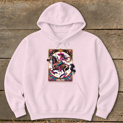Pink hoodie with a "The Cowgirl" tarot card design featuring a skeletal cowgirl on a horse.
