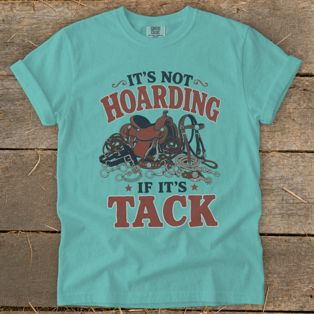 Teal t-shirt with "It's not hoarding if it's tack" text and horse tack graphic.