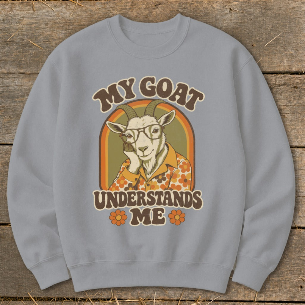 Light blue sweatshirt with a retro graphic of a goat wearing glasses and a floral shirt, text says "MY GOAT UNDERSTANDS ME".