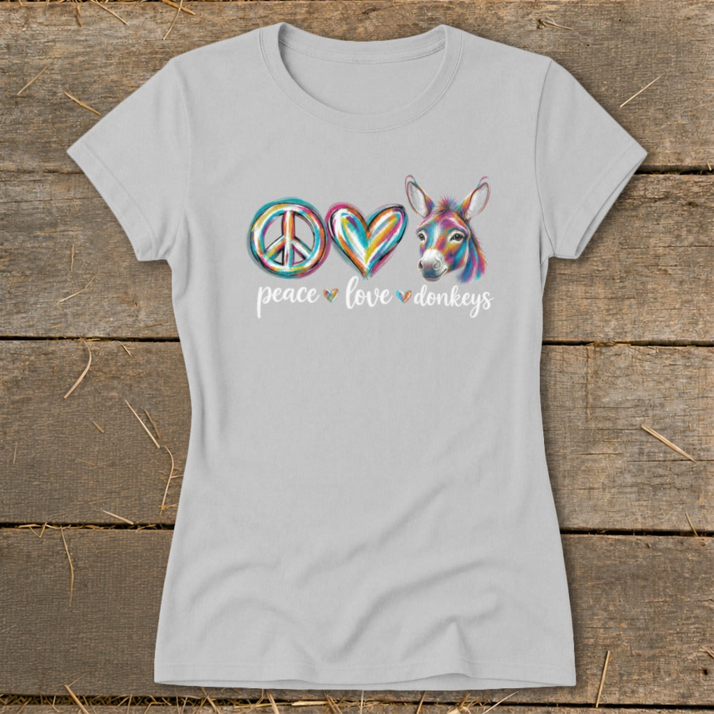 Light gray t-shirt with a peace sign, heart, and colorful donkey head, reading "peace love donkeys".