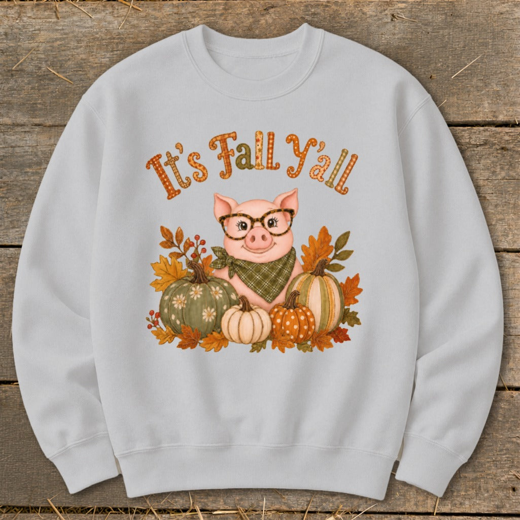 Sweatshirt with a pig wearing glasses surrounded by pumpkins and autumn leaves with "It's Fall Y'all" text.