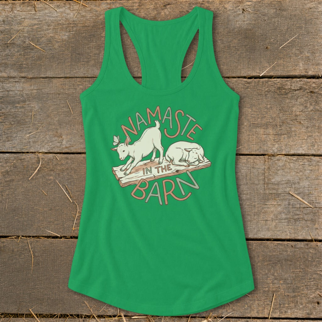 Green tank top with "Namaste in the Barn" graphic featuring two goats.
