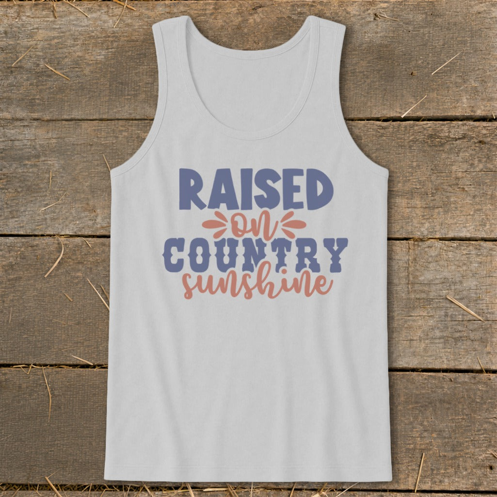 White tank top with "Raised on country sunshine" graphic in blue and pink.