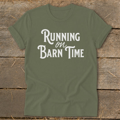 Olive green t-shirt with white text that reads "Running on Barn Time."