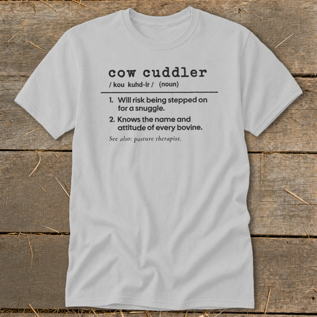 Light grey t-shirt with "cow cuddler" definition printed on it.