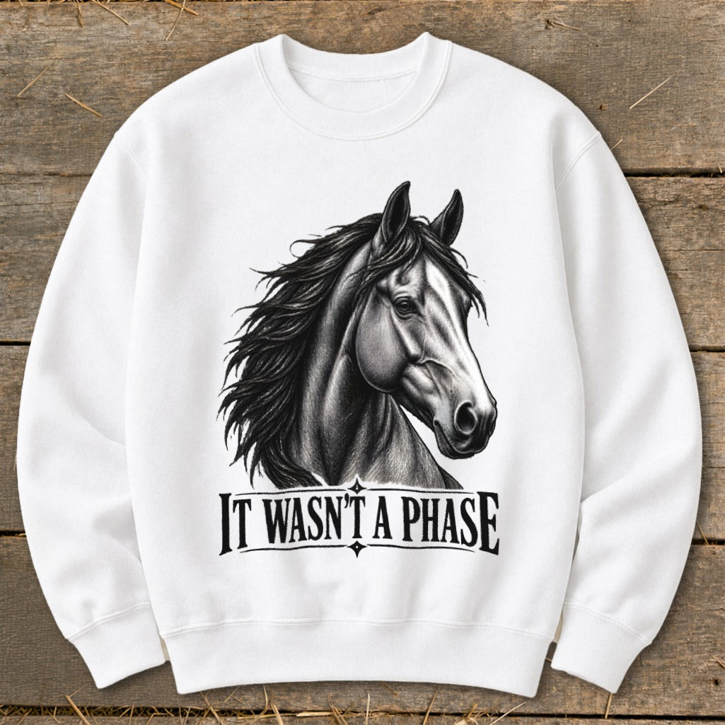White sweatshirt with a black and white drawing of a horse head and "IT WASN'T A PHASE" text.
