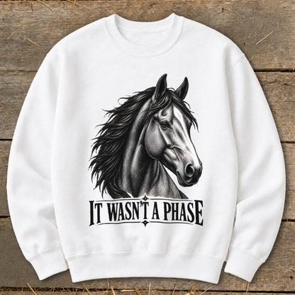 White sweatshirt with a black and white drawing of a horse head and "IT WASN'T A PHASE" text.