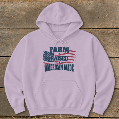 Light purple hoodie with "Farm Raised American Made" text over an American flag graphic.