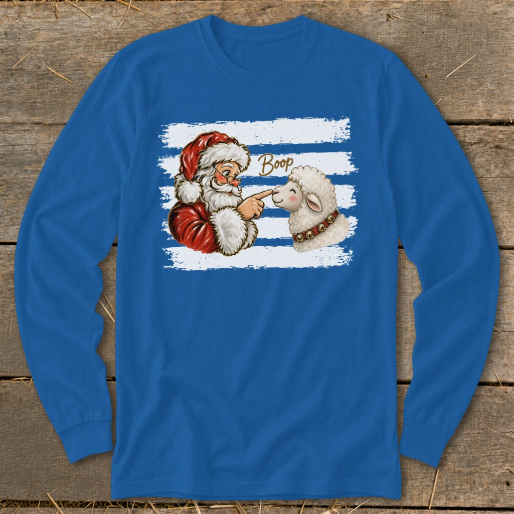Santa pointing his finger at a sheep's nose with the word "Boop".