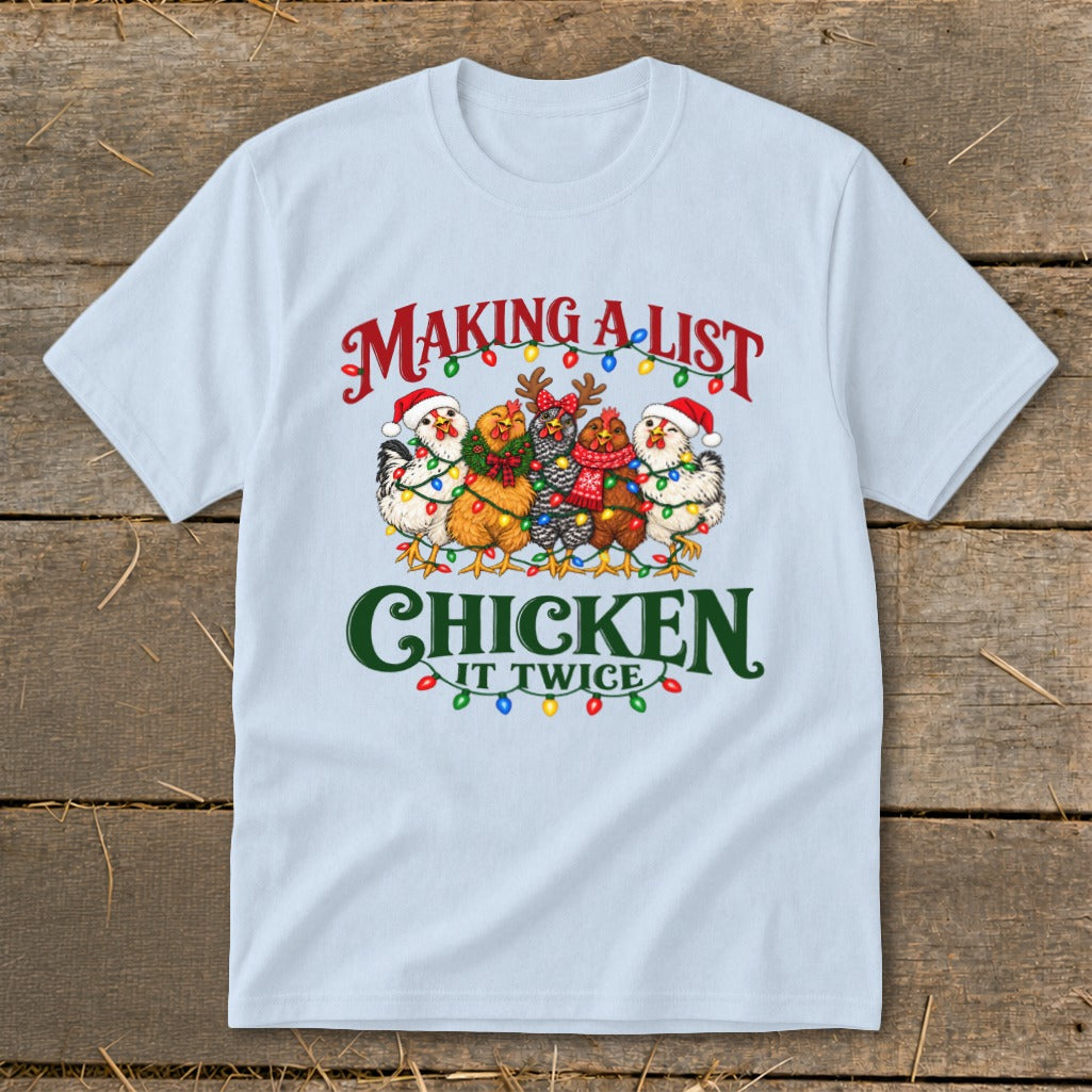 Light blue t-shirt with "Making a list, chicken it twice" text and festive chickens.