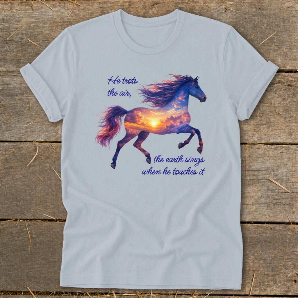 Light blue t-shirt featuring a running horse graphic filled with a sunset and inspirational text.