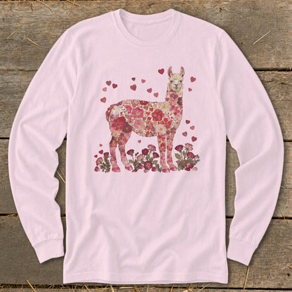 Pink long sleeve shirt with a floral llama illustration and scattered hearts.