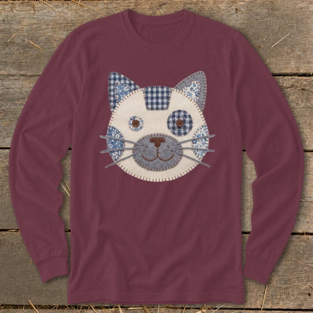 Maroon long-sleeve shirt with a fabric cat face applique on the chest.