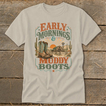 T-shirt graphic with cowboy boots, barn, windmill, cacti, and text "EARLY MORNINGS & MUDDY BOOTS".