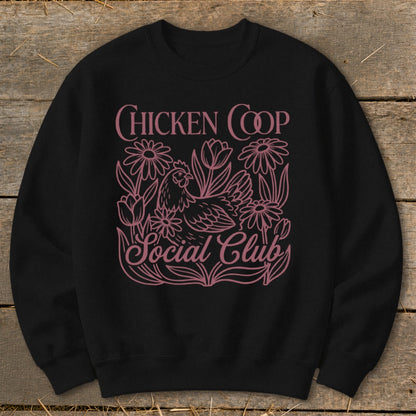 Black sweatshirt with pink "Chicken Coop Social Club" text and chicken graphic.