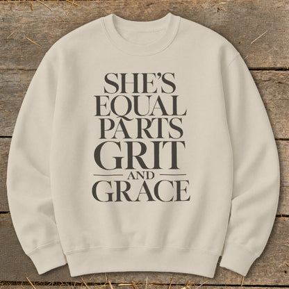 Cream sweatshirt with "She's Equal Parts Grit and Grace" text.