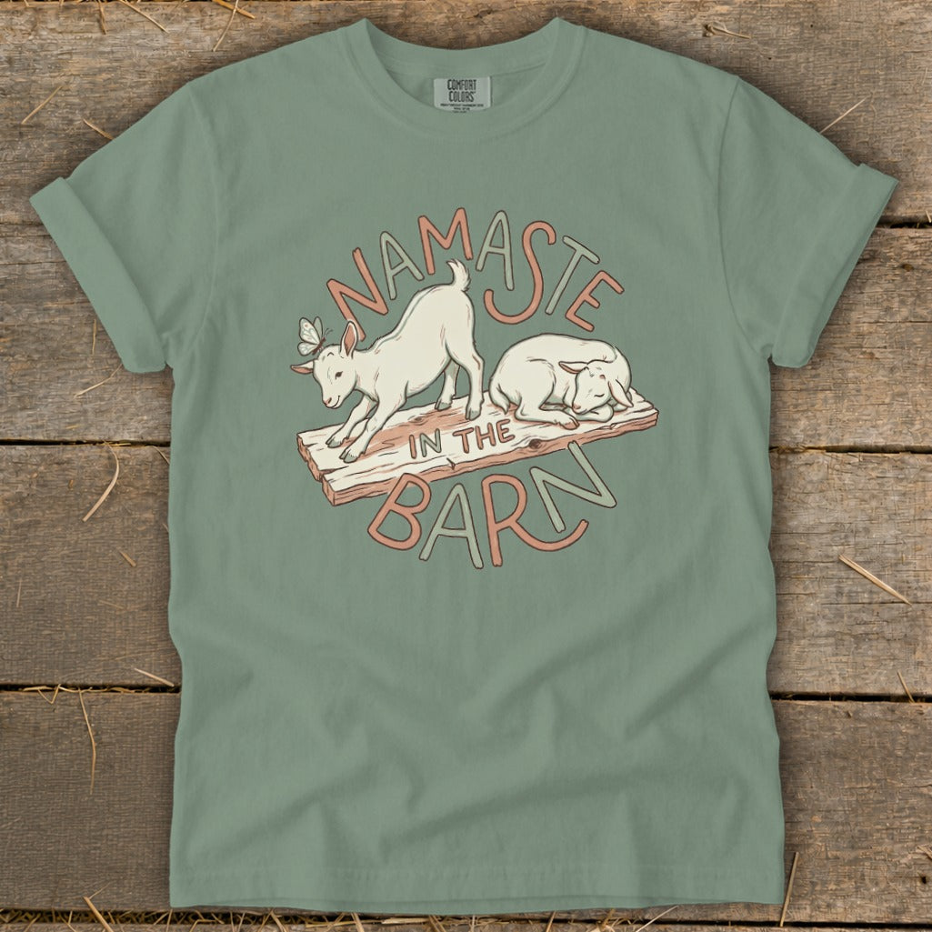 T-shirt with a graphic of two goats and the text "Namaste in the Barn".