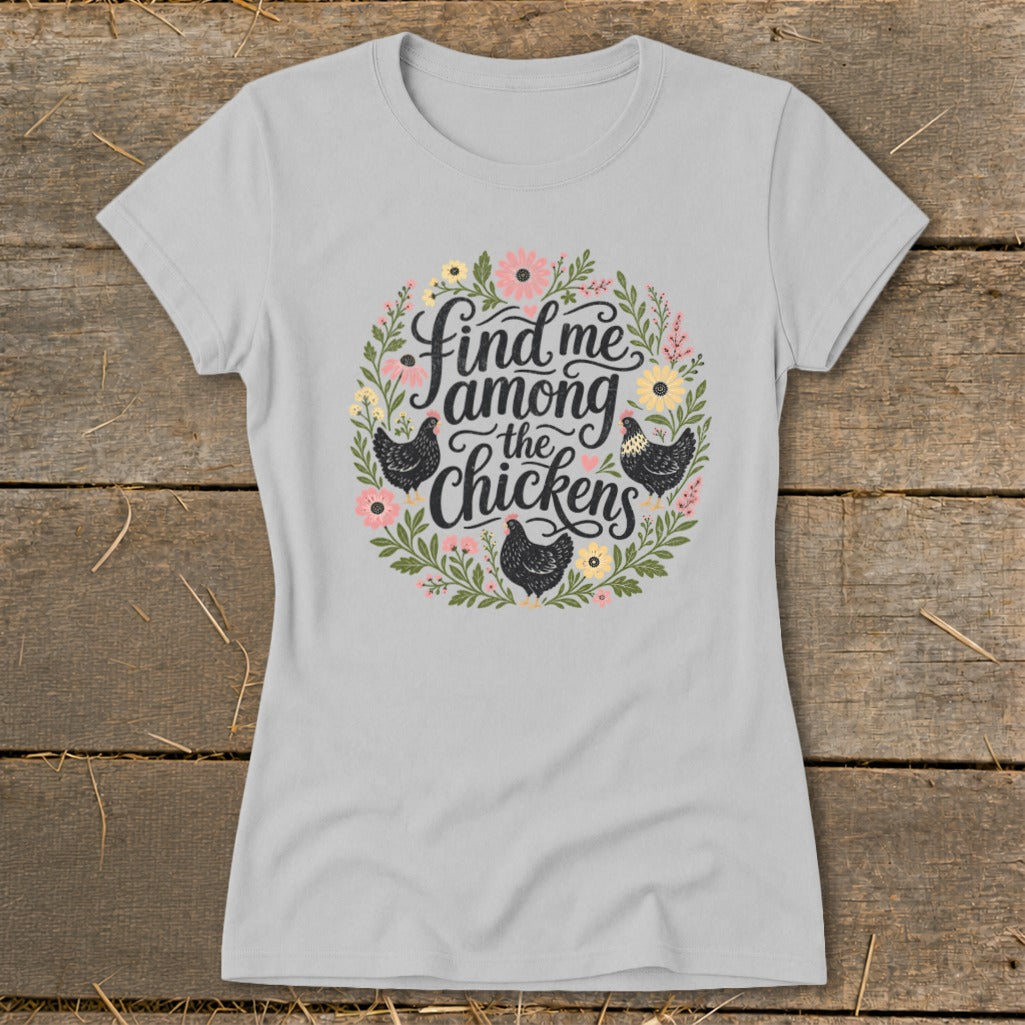 Light grey t-shirt with "Find me among the chickens" text and floral design.