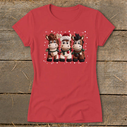 Red t-shirt with a Christmas graphic of three cartoon horses wearing scarves and garlands.