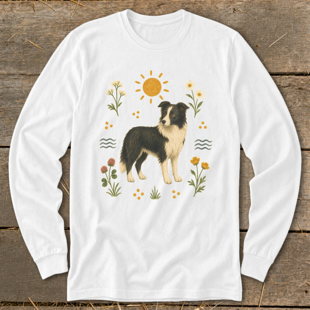White long-sleeved shirt with a Border Collie, sun, and floral design.