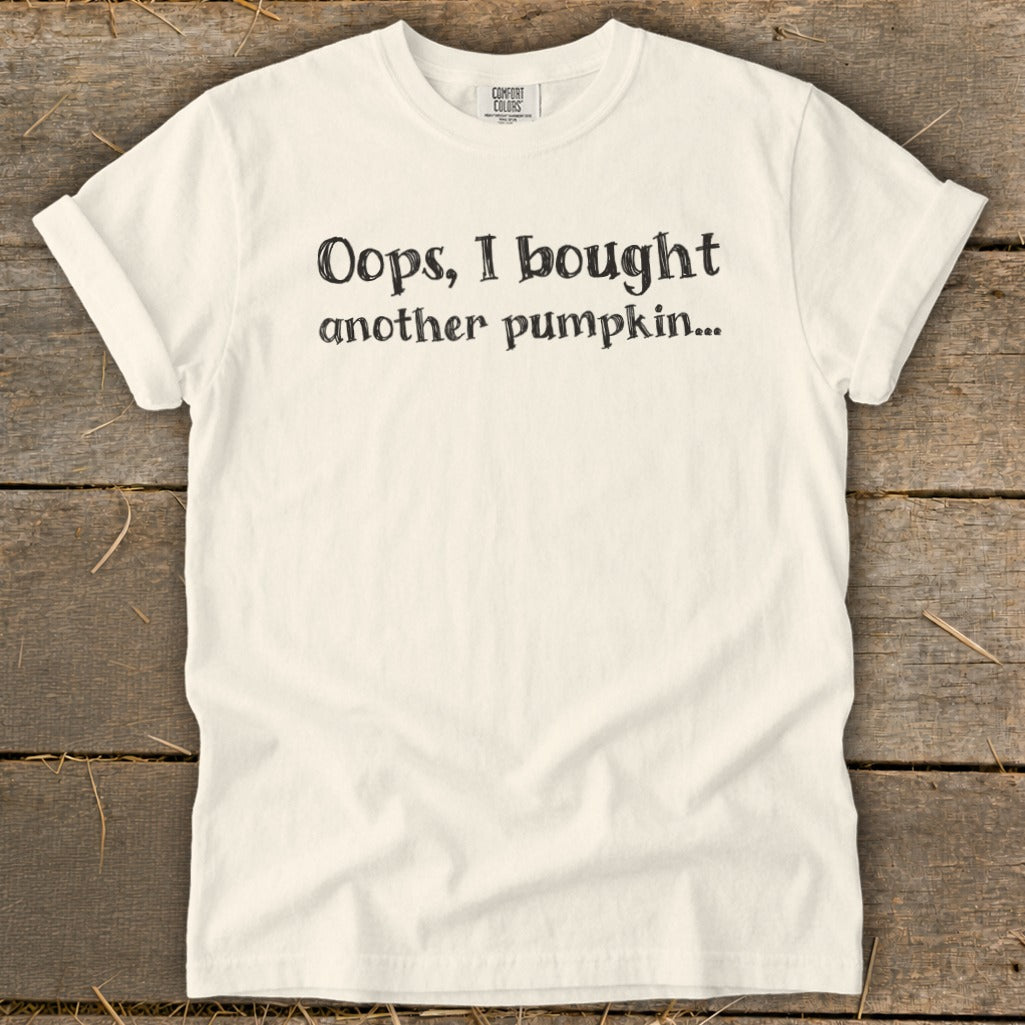 Cream t-shirt with "Oops, I bought another pumpkin..." text.