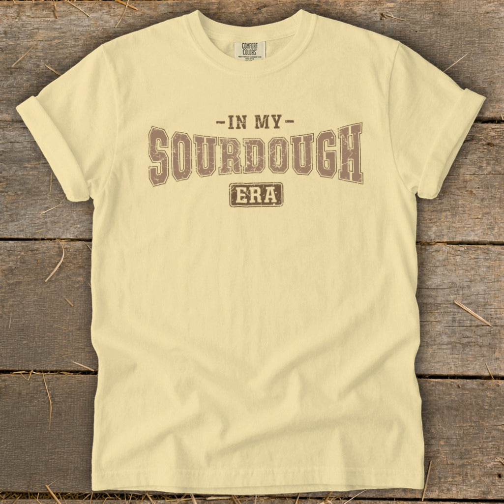Light yellow t-shirt with "In My Sourdough Era" printed in brown text.