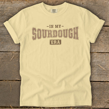 Light yellow t-shirt with "In My Sourdough Era" printed in brown text.