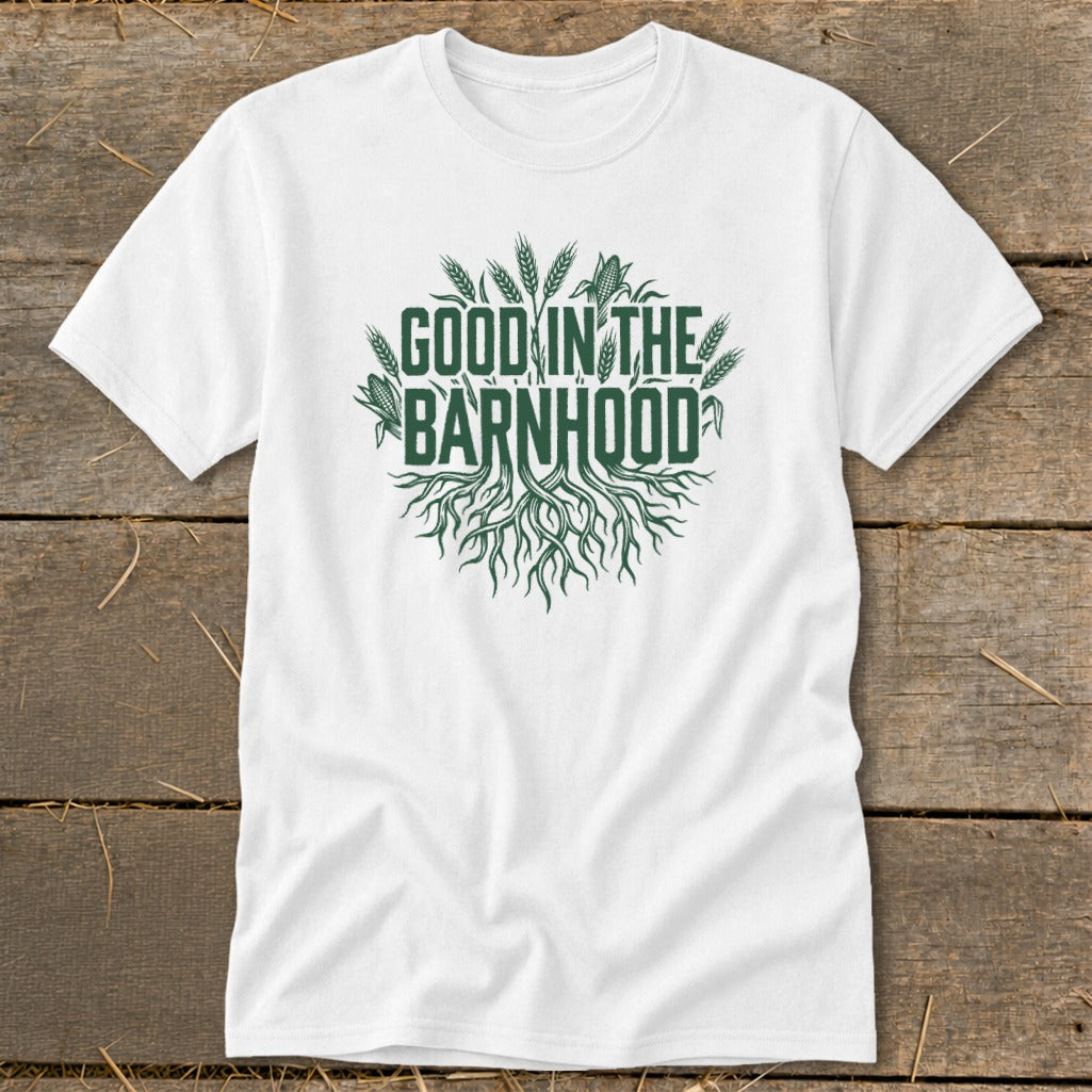 White t-shirt with green text and graphic: "Good in the Barnhood" with roots and wheat.