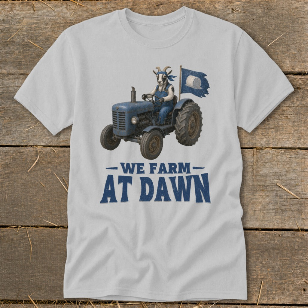 Goat wearing overalls drives blue tractor with flag; text reads "WE FARM AT DAWN."